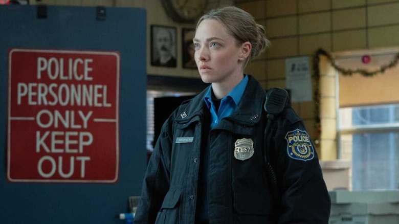 Mickey in uniform in the police station looking concerned in Long Bright River
