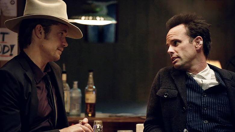 Raylan and Boyd look at one another at a bar in "Justified" (2010-2015)