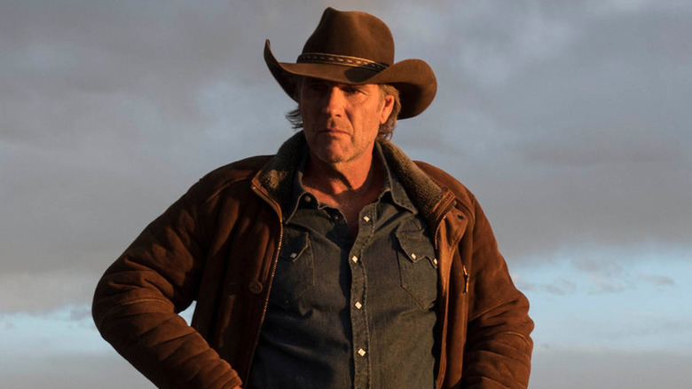 Longmire standing outside look contemplative in "Longmire" (2012-2017)