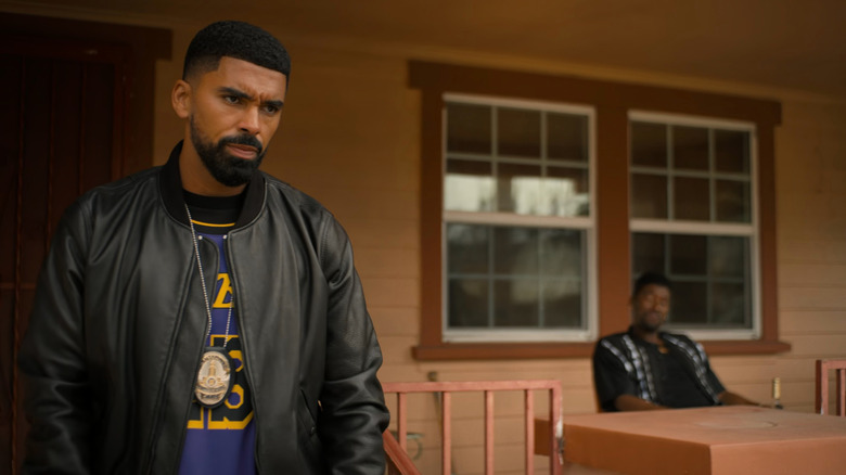 Isaiah frowning on porch in Nemesis (2026)