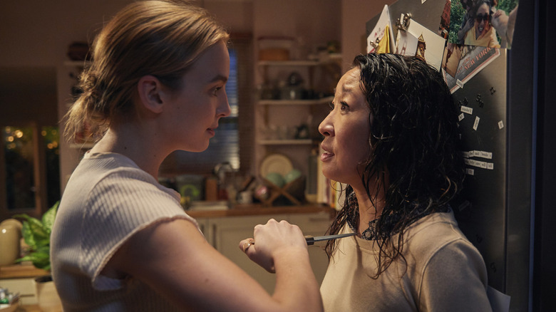 Villanelle holds a knife to Eve's throat in Killing Eve (2018)