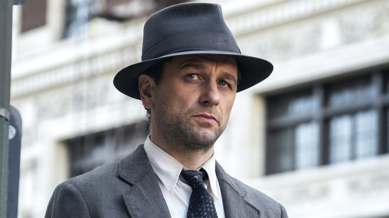 Mason in his suit and hat in "Perry Mason" (2020-2023)