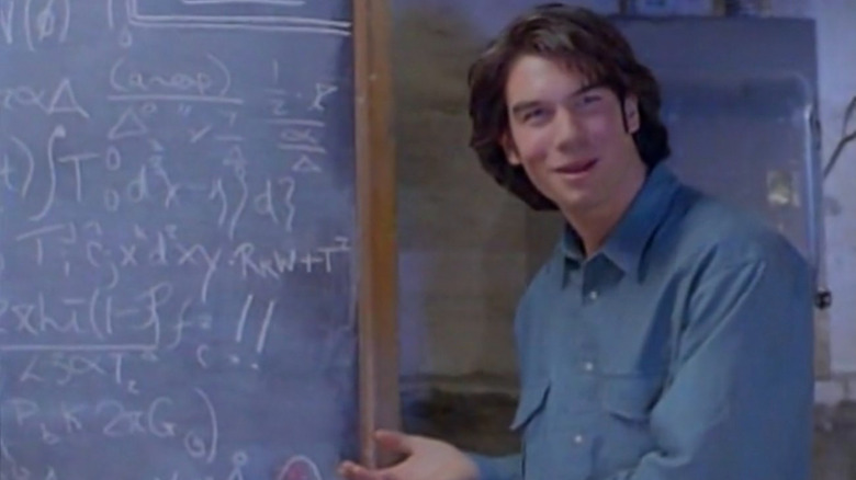 Quinn Mallory by a chalkboard in "Sliders"