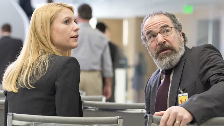 Carrie Mathison and Saul Berenson looking behind them on "Homeland" (2011-2020)