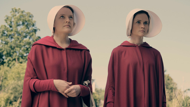 Offred and Ofglen looking up in their Handmaid outfits on The Handmaid's Tale