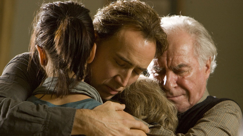 John Koestler hugs his family in "Knowing" (2009)