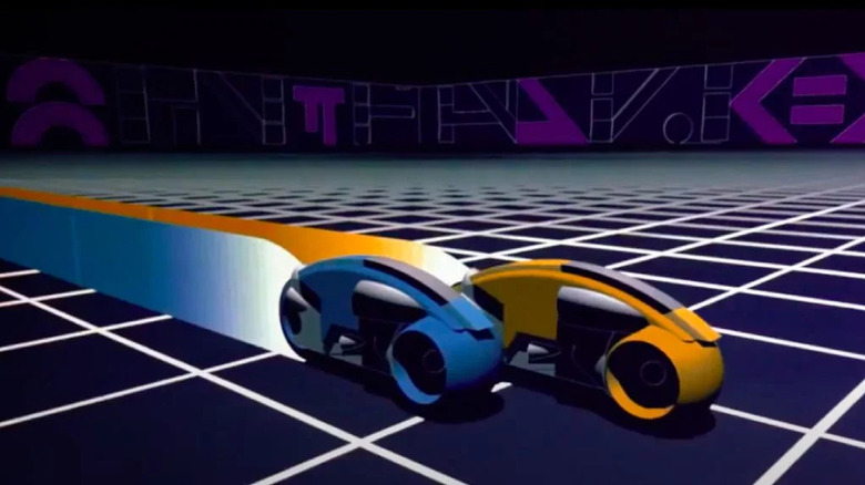 Light cycles race across the grid in "Tron" (1982)