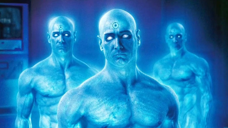 Three Doctor Manhattans stand together in "Watchmen" (2009)