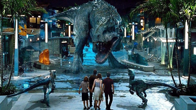 The Indominus Rex looms over Owen, Claire, Zach, Gray and the raptors in Jurassic World