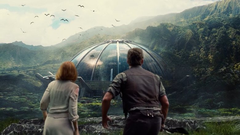 Claire and Owen stare at the aviary in Jurassic World