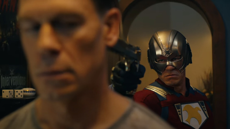 Peacemaker pointing a gun at his alternate self in Peacemaker (2025)
