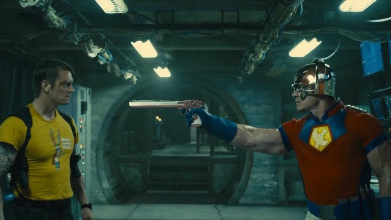 Rick Flag being held at gunpoint by Peacemaker in The Suicide Squad (2021)
