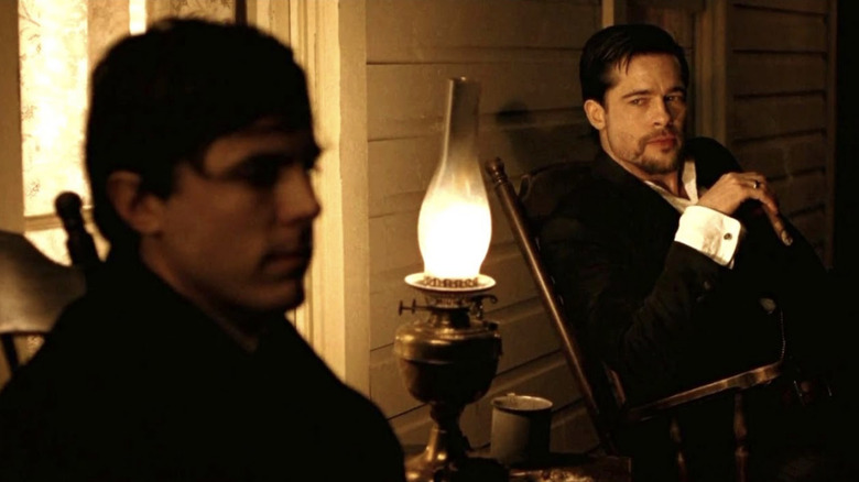 Robert Ford and Jesse James on a porch in The Assassination of Jesse James by the Coward Robert Ford (2007)