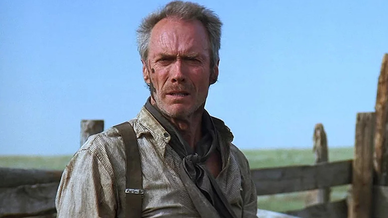 William Munny looks out in a field in Unforgiven (1992)