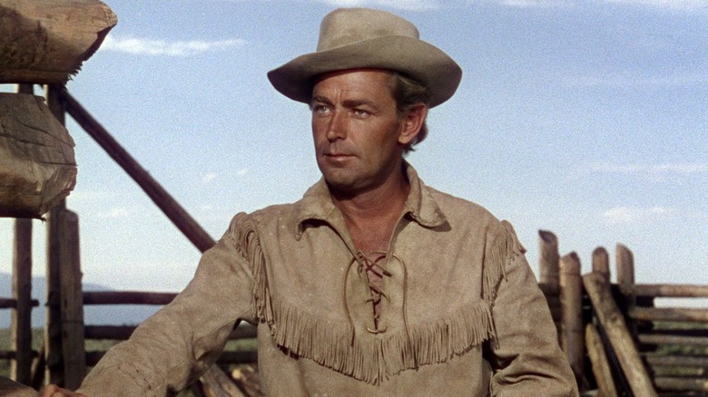 Shane (Alan Ladd) standing outside in "Shane."