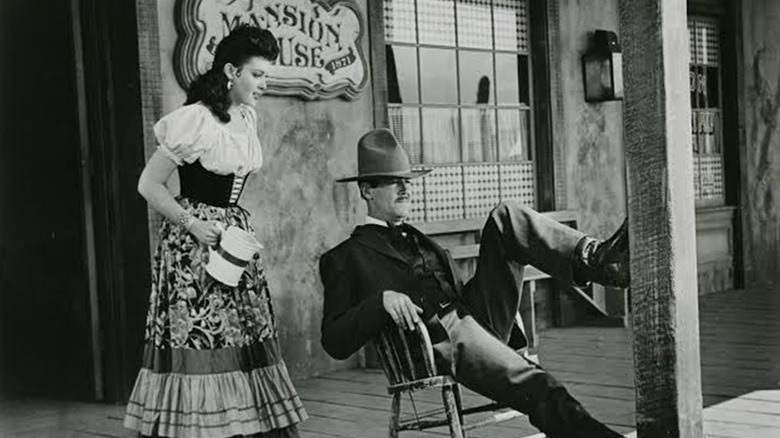 Wyatt Earp leaning around on a porch in My Darling Clementine (1946)