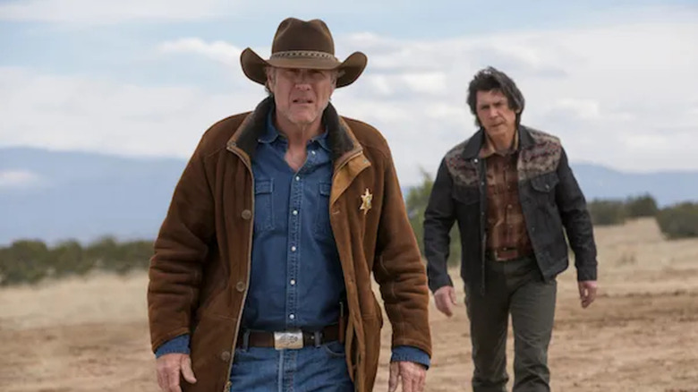 Walt Longmire and Henry Standing Bear walk in "Longmire"