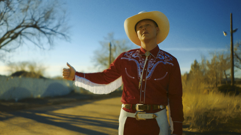 Billy Tillerson hitchhiking in "Outer Range"