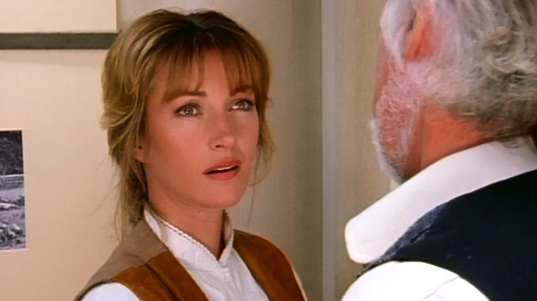 Dr. Quinn looking at someone on "Dr. Quinn, Medicine Woman" (1993-1998)