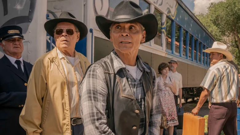 Lt. Joe Leaphorn and Sheriff Gordo beside a train on Dark Winds (2022-present)