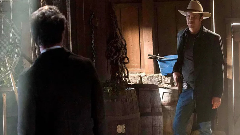 Marshal Raylan Givens confronts Boyd Crowder (seen from behind) on Justified (2010-2015)