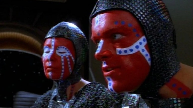 Two Dosi with red, white, and blue face paint on Star Trek: Deep Space Nine