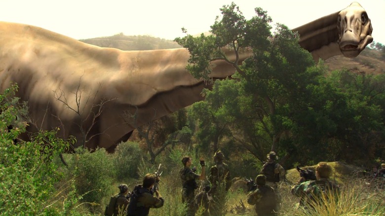 A gigantic dinosaur towering over humans in 100 Million BC (2008)