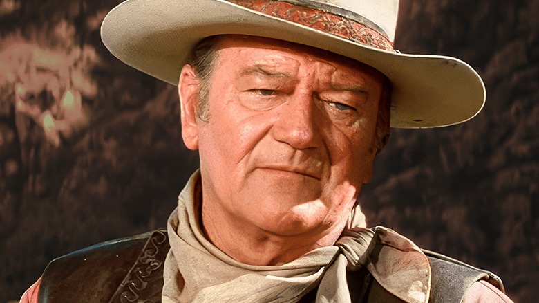 John Wayne wearing a cowboy hat and looking serious