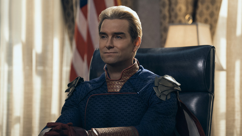 Homelander sitting behind the president's desk in 