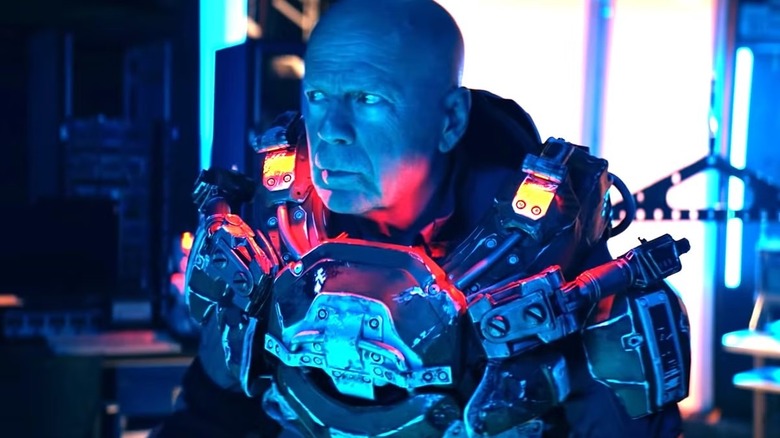 James in a spacesuit in blue light in "Cosmic Sin" (2021)