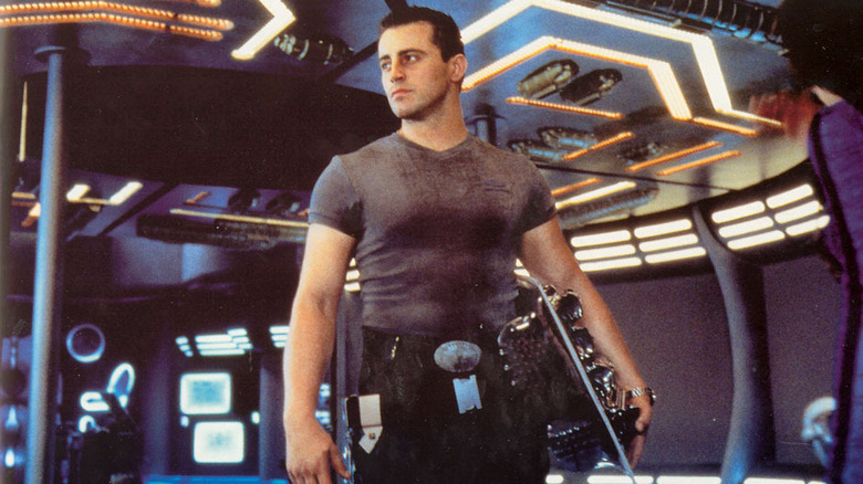 Major Don West stands in the center of the ship in "Lost in Space" (1998)