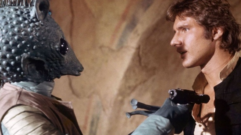 Greedo holds Han Solo at gunpoint in Star Wars: Episode IV — A New Hope (1977)