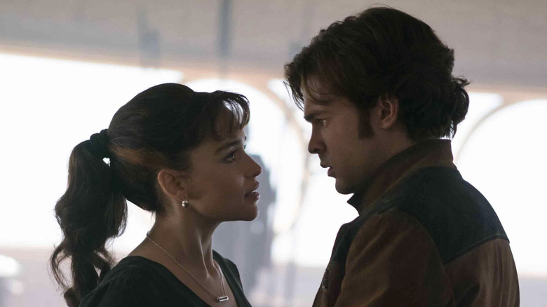 Qi're and Han Solo staring into each other's eyes in "Solo: A Star Wars Story"