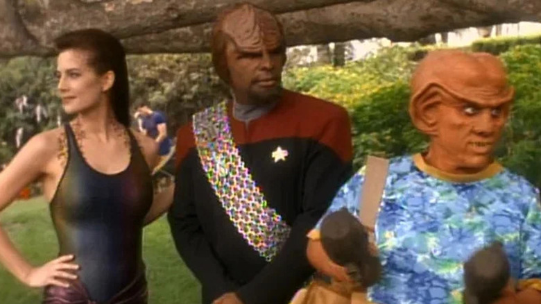 Jadzia Dax, Worf, and Quark standing outdoors on "Star Trek: Deep Space Nine" (1991-1998)