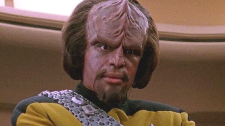 Worf looking thoughtful and wearing a Starfleet uniform on 