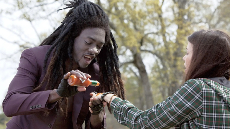 Bella getting hot sauce put on her hand by a vampire in Vampires Suck