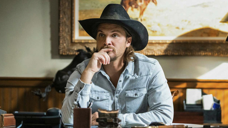 Kayce Dutton looking thoughtful at a desk on Yellowstone