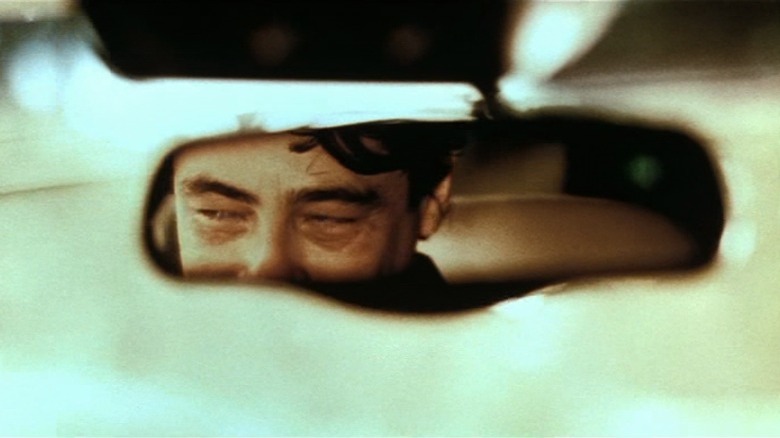   Benicio del Toro in the rearview