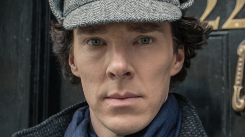 Sherlock standing outside his flat
