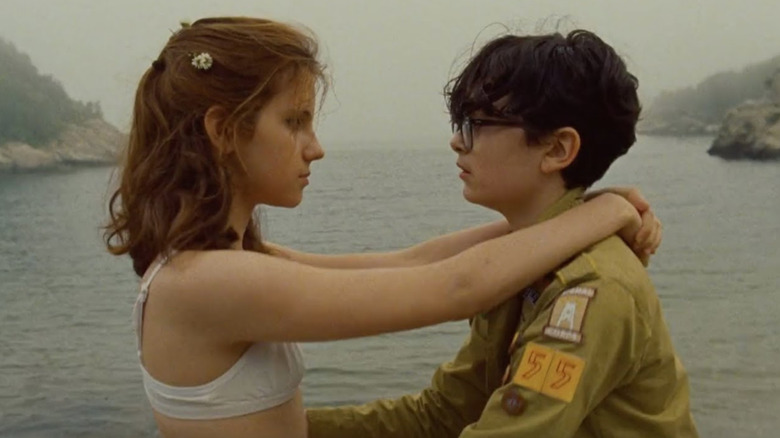 Suzy and Sam holding each other