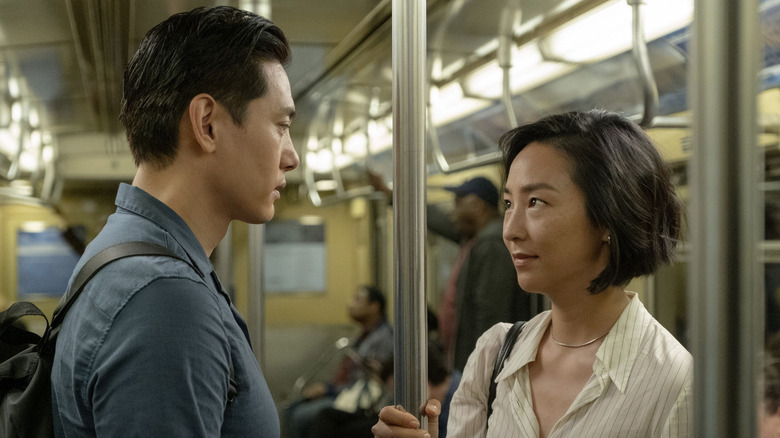 Nora and Hae Sung riding subway