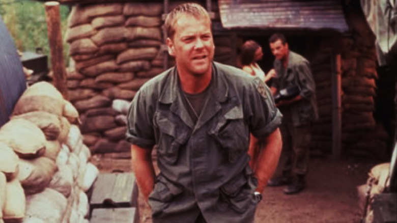 Rat Kiley walking through American trenches