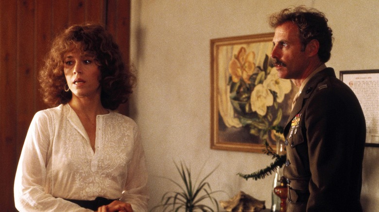 Bob confronts Sally in their living room