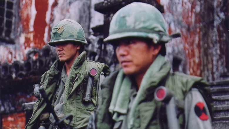 South Korean army squad approaching abandoned building