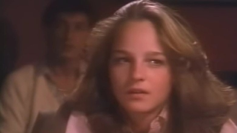 Helen Hunt looks at something off-screen