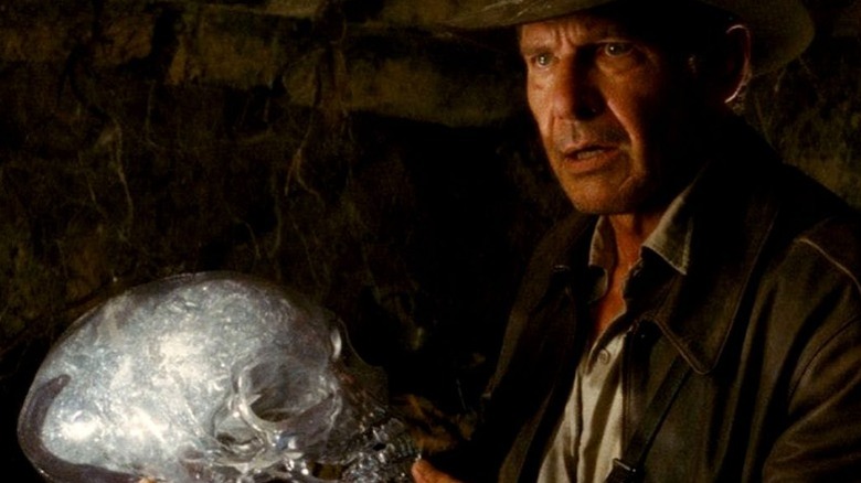 Indiana Jones holds a skull in "Indiana Jones and the Kingdom of the Crystal Skull" (2008)