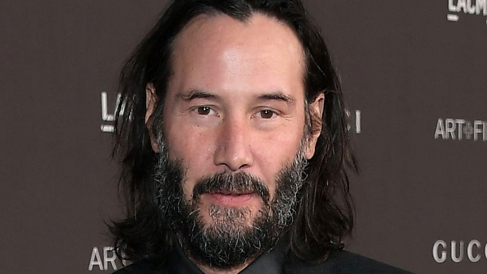 Keanu Reeves beard grinning