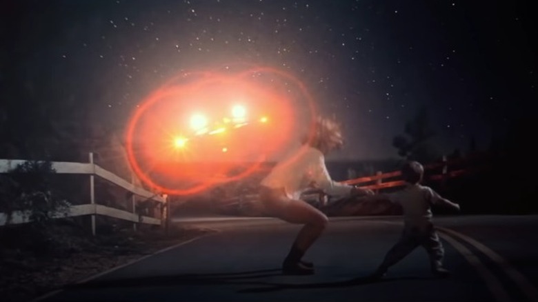 Jillian and Barry running from UFO