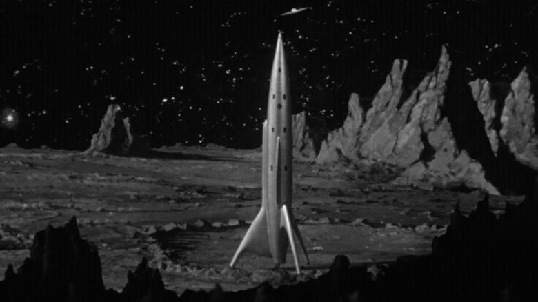 Rocket ship on rocky landscape