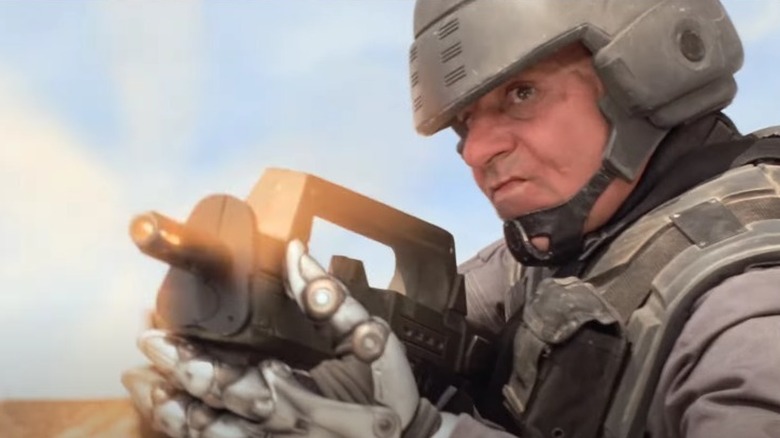 Jean Rasczak firing rifle